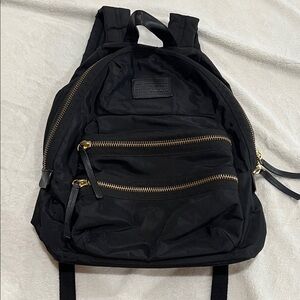 Nylon Backpack. Used. Good condition. It’s been washed and inside reflects it.